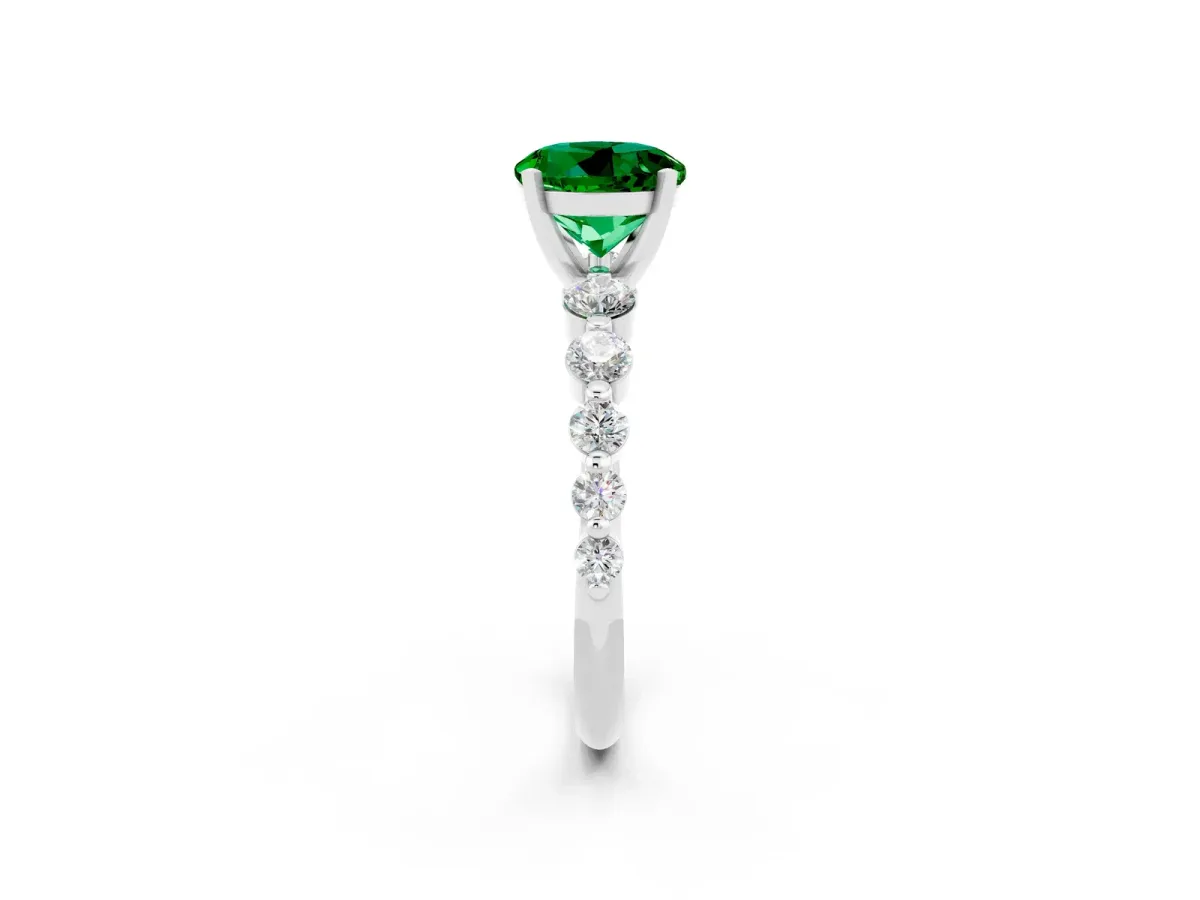 Round Cut Solitaire Emerald Ring with Pave Band and Four-Prong Setting Platinum