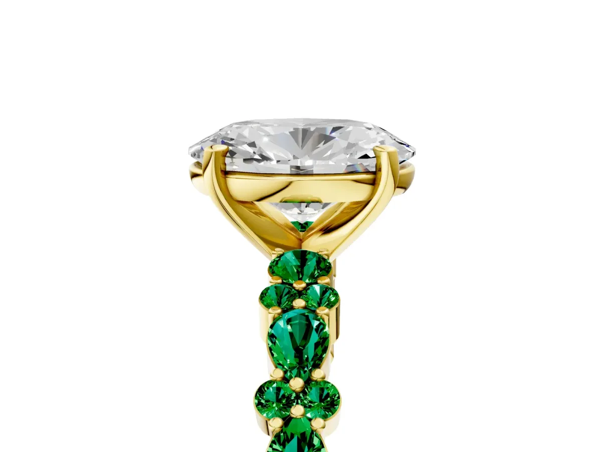 Oval Cut Diamond Side Stone Solitaire Ring with Round Emerald and Four-Prong Setting Yellow gold
