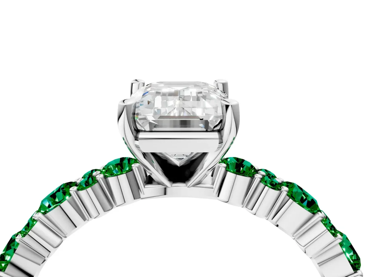 Emerald Cut Diamond Side Stone Solitaire Ring with Round Emerald and Four-Prong Setting Platinum