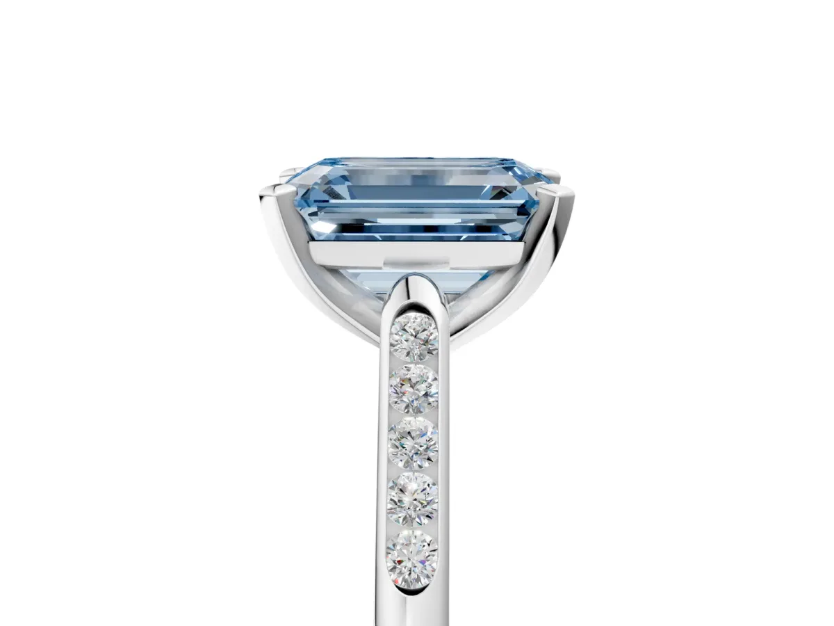 Fancy Blue Emerald Cut Diamond Solitaire Ring with Channel Set Round Band and Prong Setting Silver