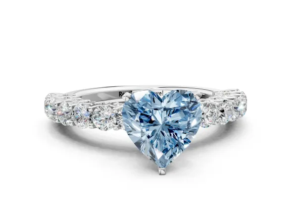 Fancy Blue Heart Cut Diamond Solitaire Ring with Shared Prong Pavé Band and Four-Prong Setting Platinum