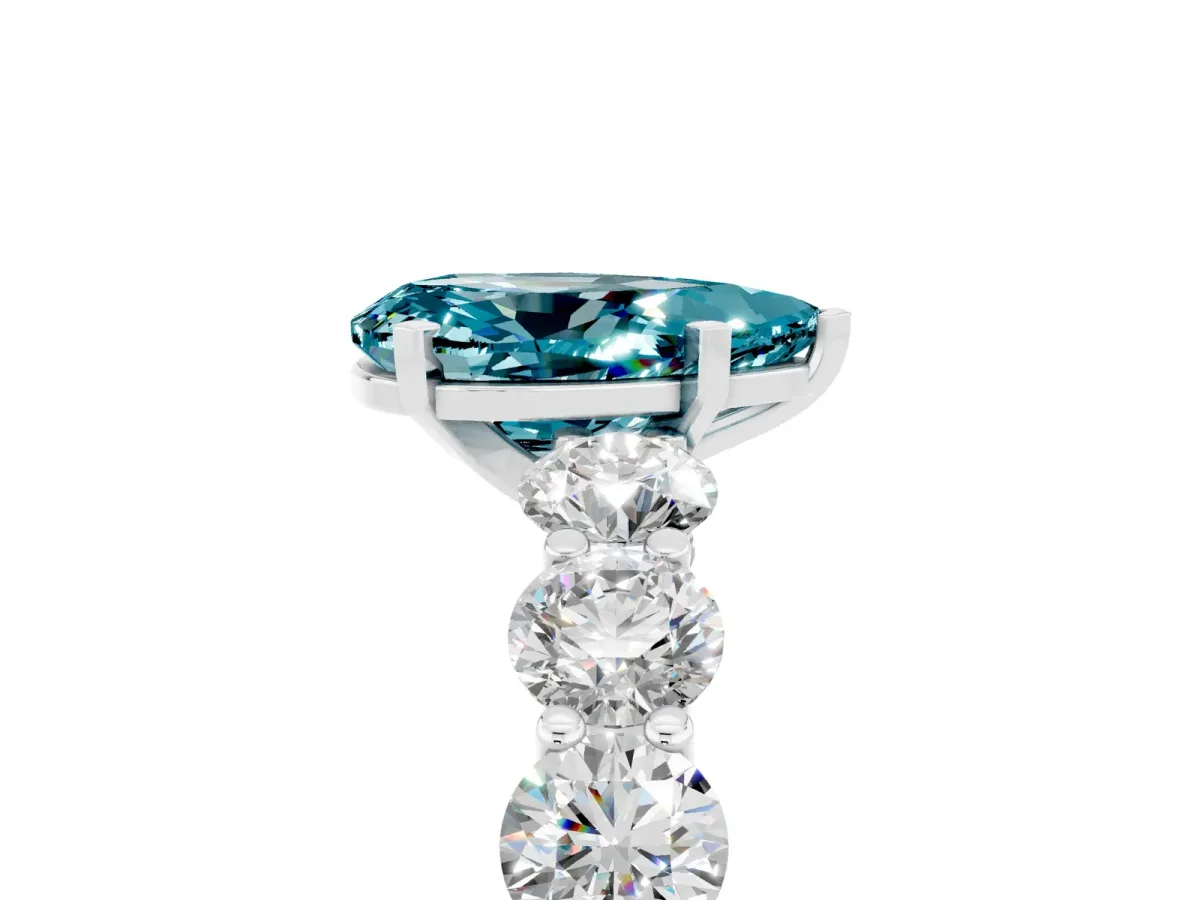 Pear Cut Blue Topaz Prong Setting with Side Stones on a Pave Band Silver