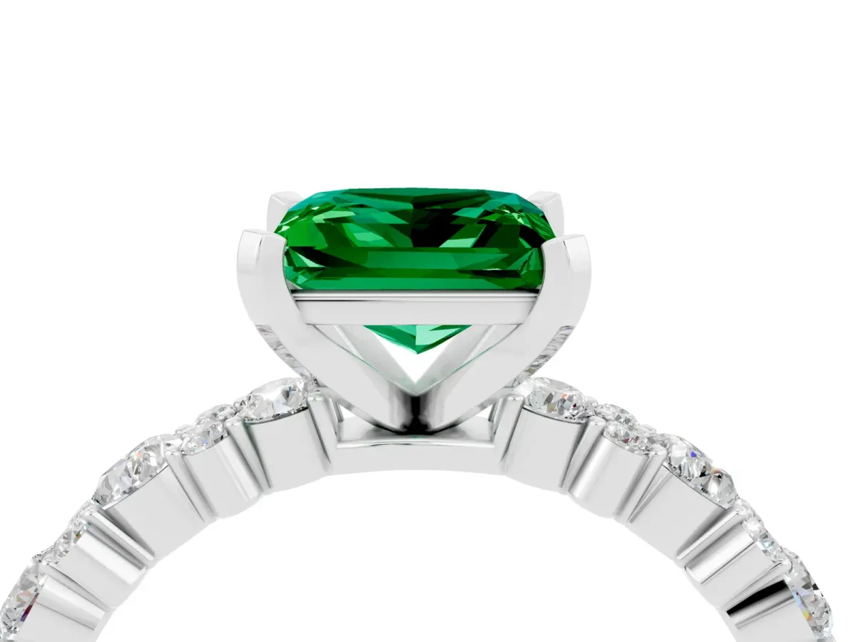 Princess Cut Emerald Side Stone Solitaire Ring with Round and Four-Prong Setting Silver