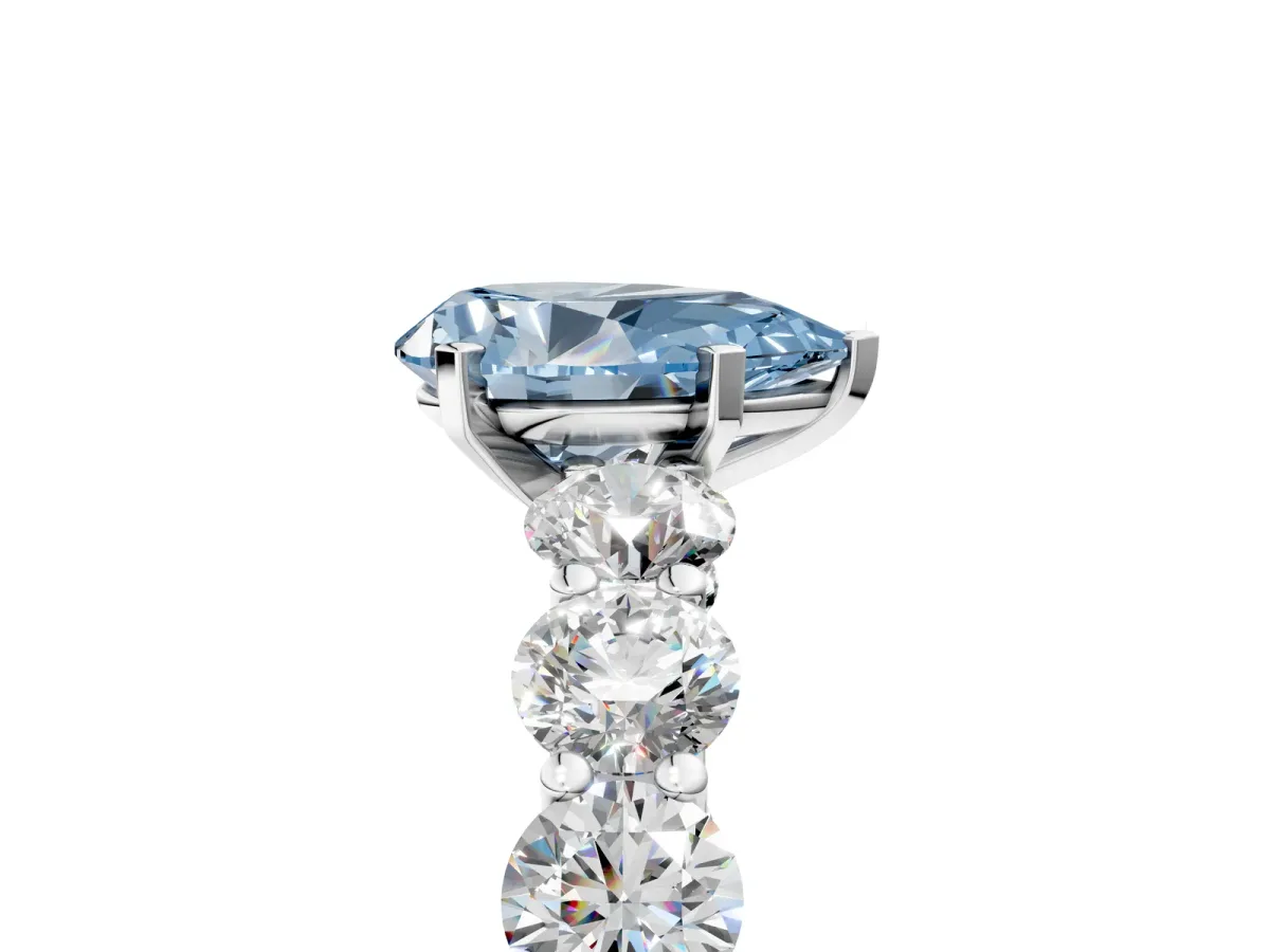 Fancy Blue Pear Cut Diamond Prong Setting with Side Stones on a Pave Band Platinum