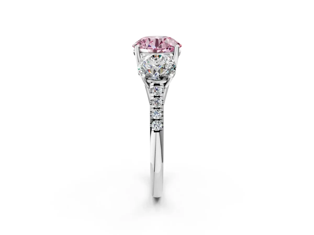 Fancy Pink Three-Stone Round Cut Diamond Ring with Round Pavé Band and Prong Setting Silver