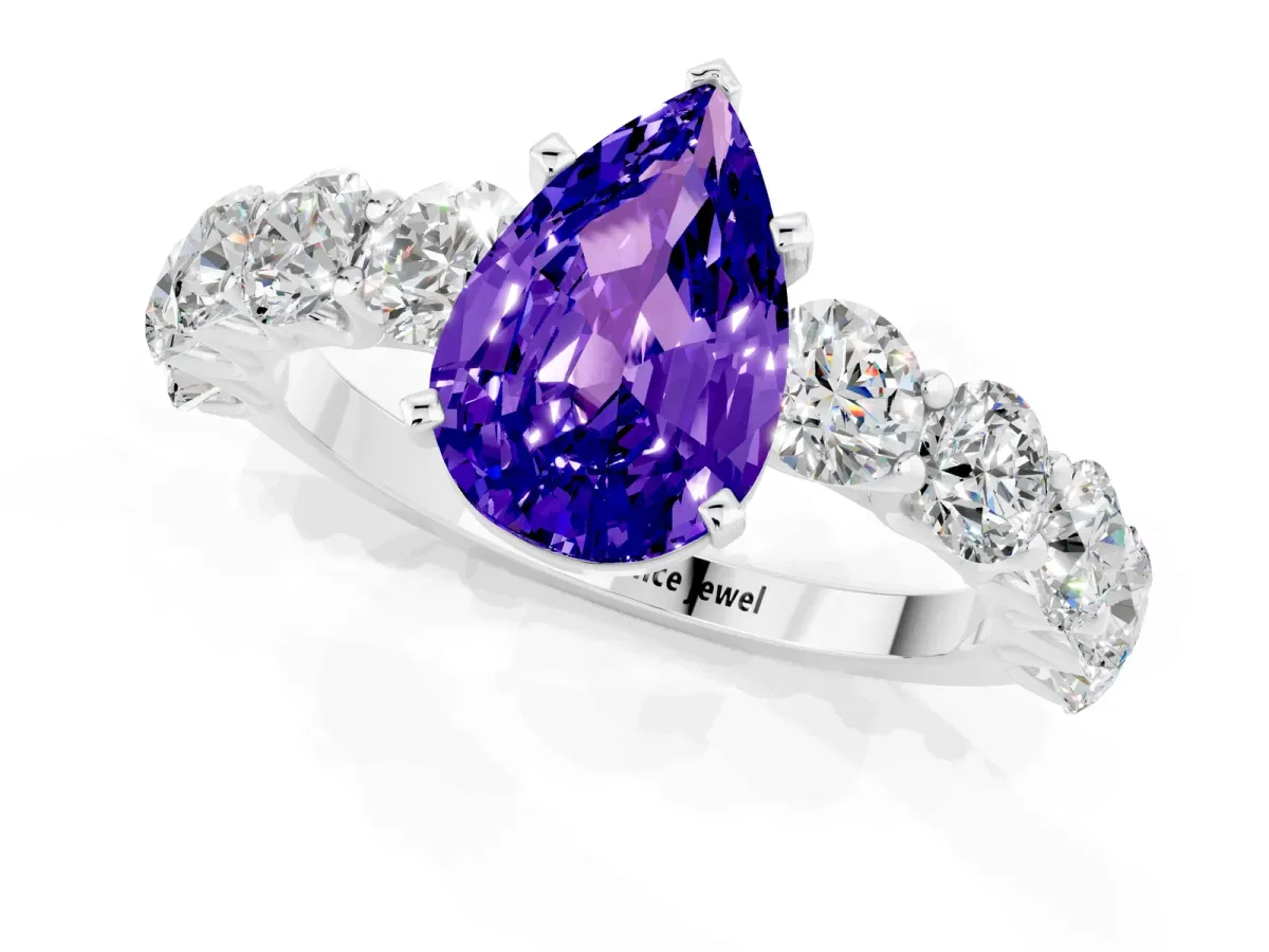 Pear Cut Tanzanite Prong Setting with Side Stones on a Pave Band Platinum