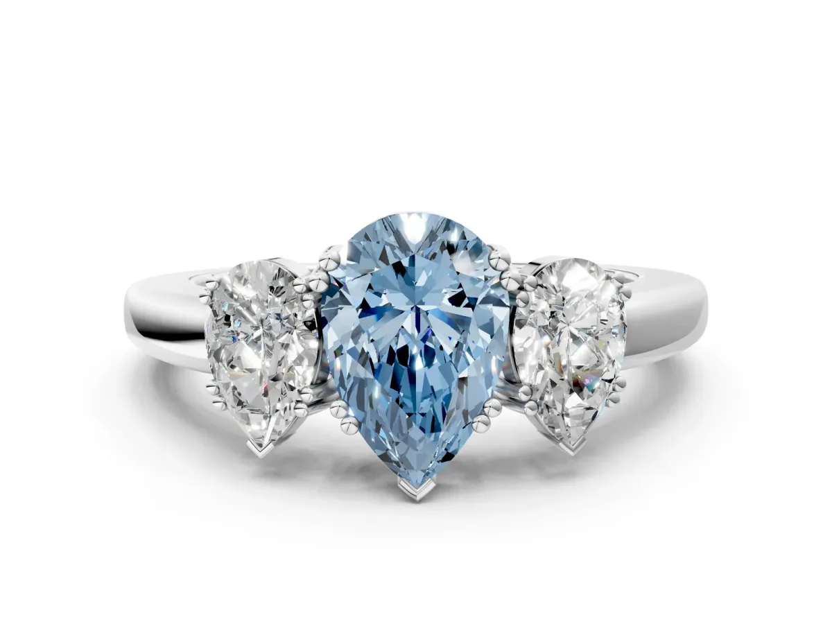 Fancy Blue Three-Stone Pear Cut Cut Diamond Ring with Channel Set Band and Four-Prong Setting Silver