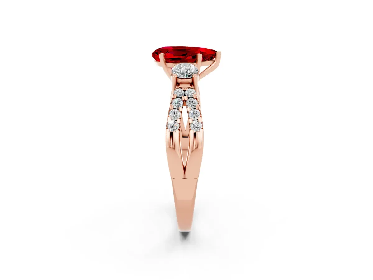 Pear Cut Ruby Three-Stone Ring with Pavé Split Shank and Four-Prong Setting Rose gold