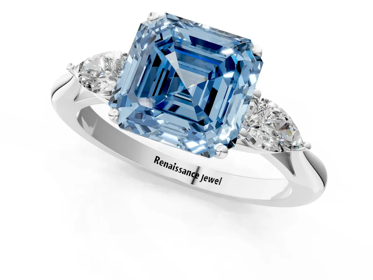 Fancy Blue Three-Stone Asscher Cut Diamond Ring with Pear Side Stones in Four-Prong Setting Platinum