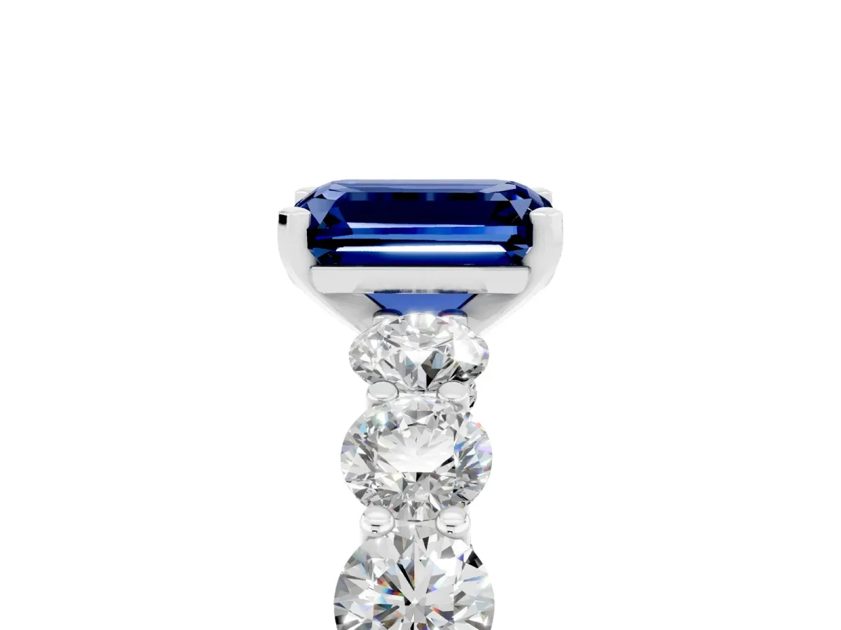 Emerald Cut Blue Sapphire Prong Setting with Side Stones on a Pave Band Silver