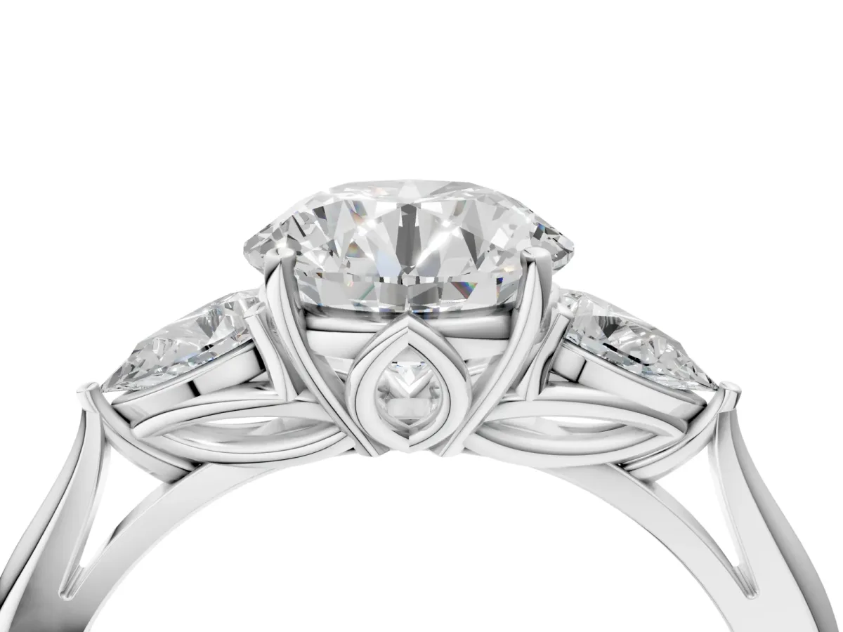 Three-Stone Round Cut Diamond Ring with Pear Side Stones in Four-Prong Setting Platinum