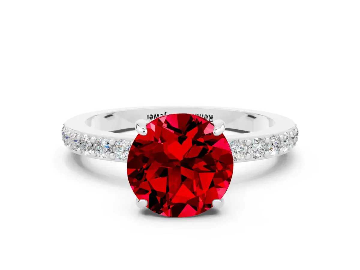 Round Cut Ruby Solitaire Engagement Ring with Pavé Band and Four-Prong Setting Silver