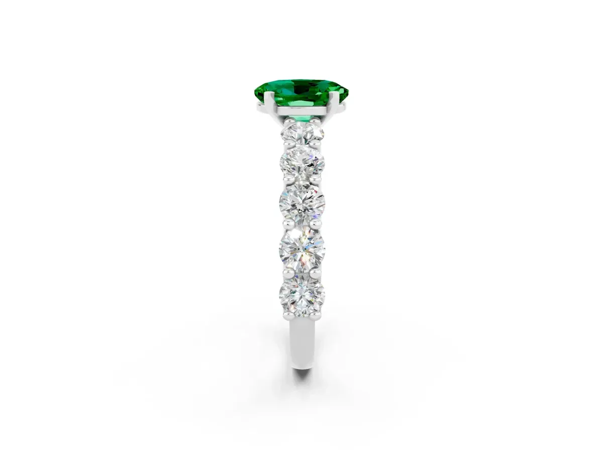 Oval Cut Emerald Prong Setting with Side Stones on a Pave Band Platinum