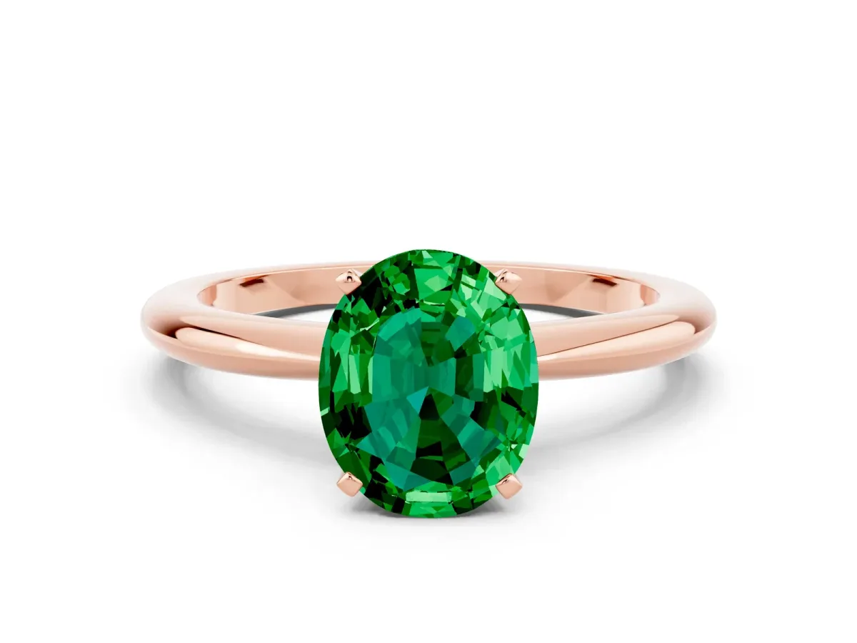 Oval Cut Emerald Solitaire Ring with Six-Prong Setting and Classic Band Rose gold