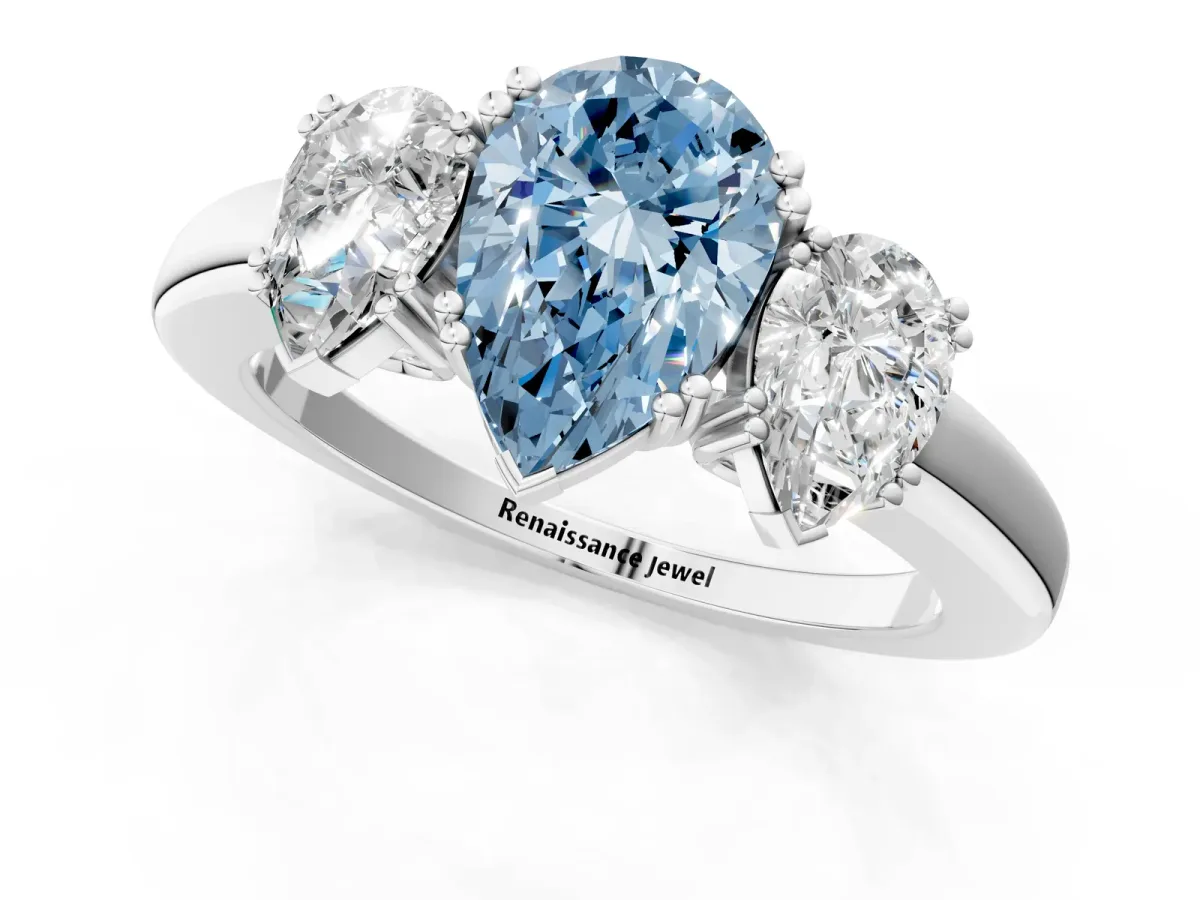 Fancy Blue Three-Stone Pear Cut Cut Diamond Ring with Channel Set Band and Four-Prong Setting Silver
