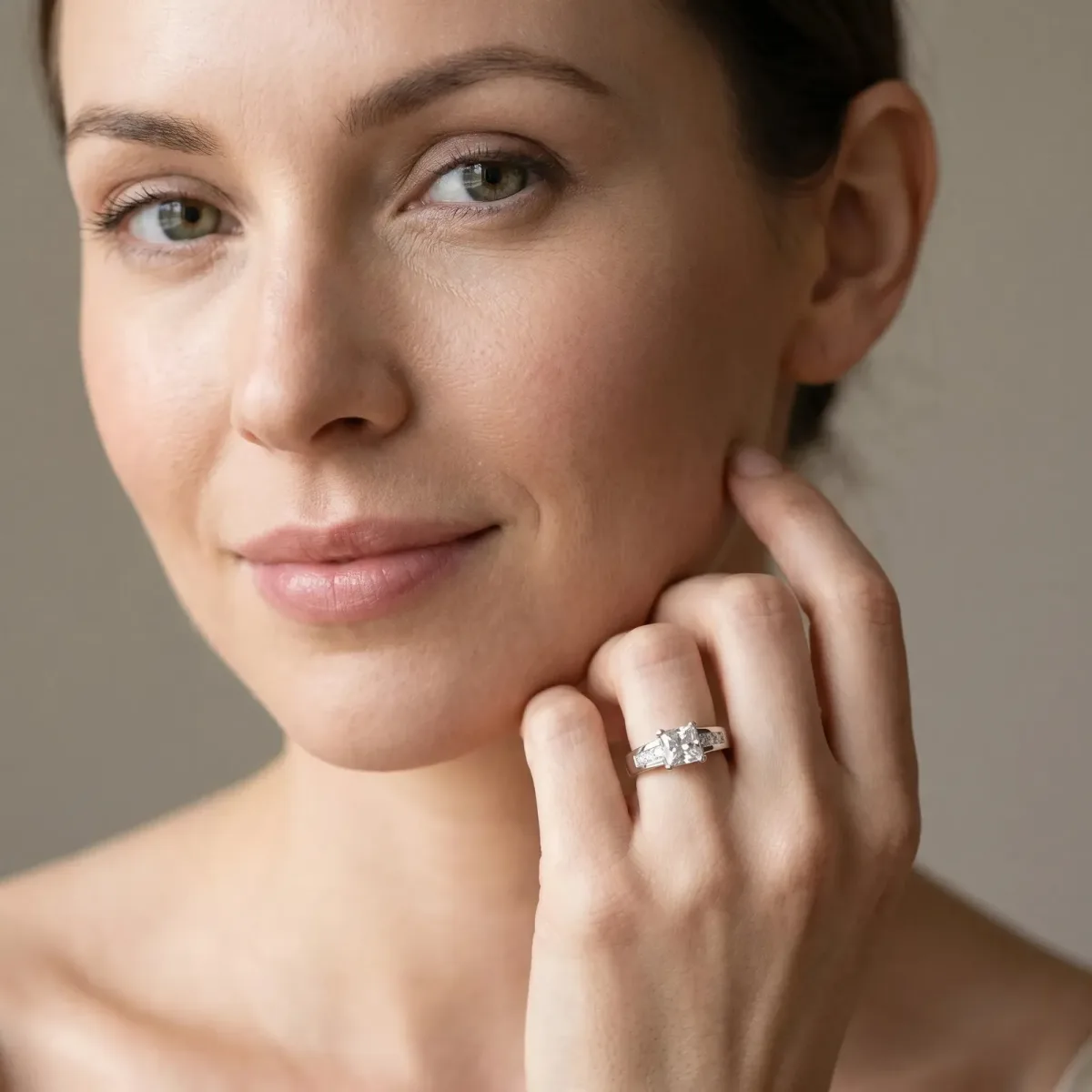 Cushion Cut Cut Channel Set Solitaire Ring with Four-Prong Setting Platinum