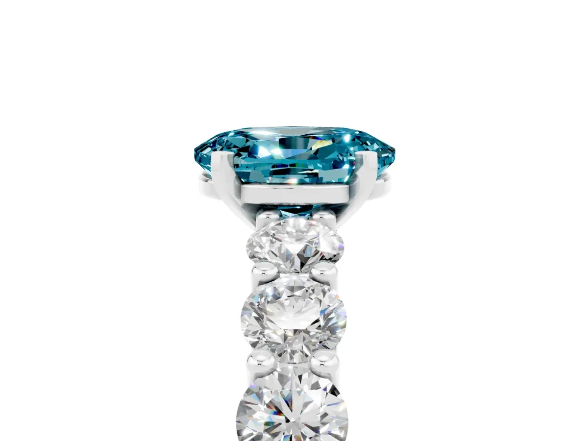 Oval Cut Blue Topaz Prong Setting with Side Stones on a Pave Band Silver