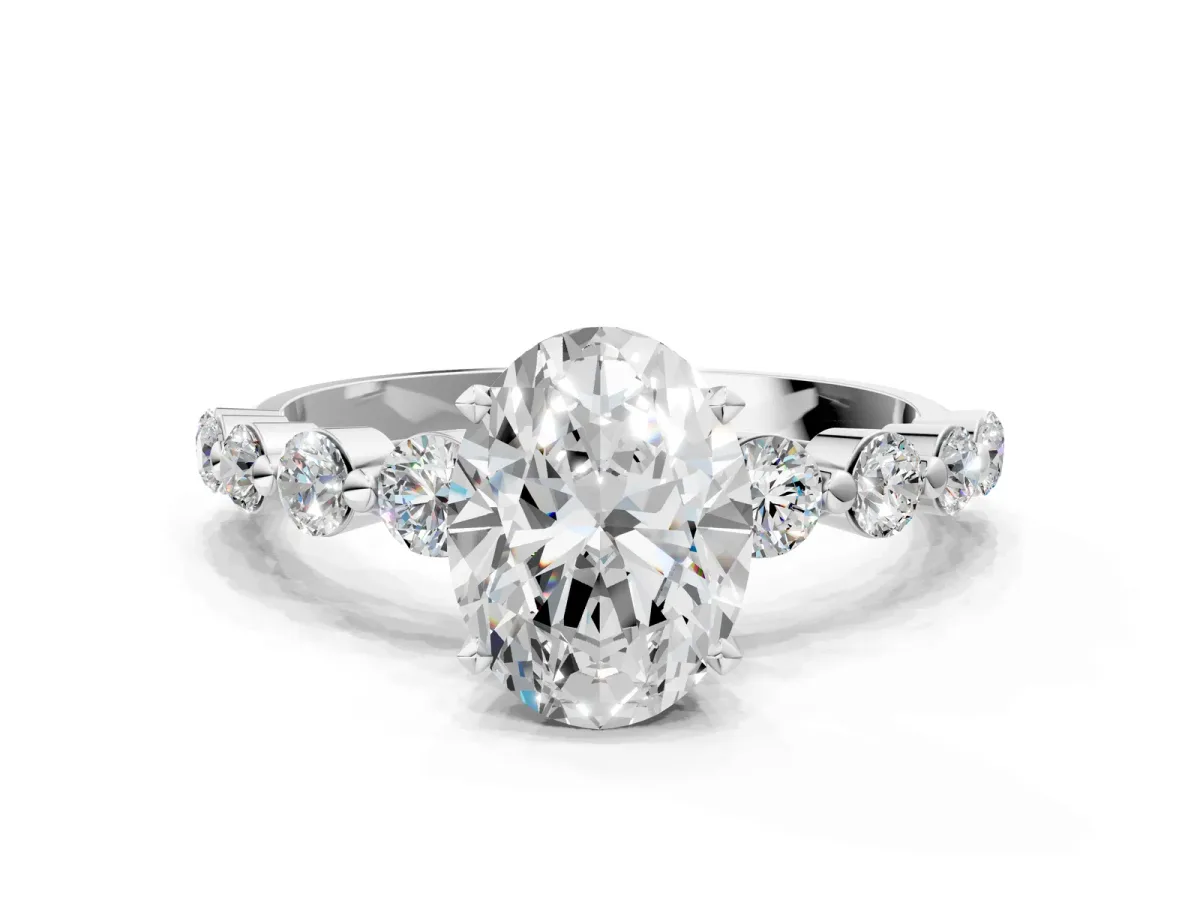 Oval Cut Solitaire Diamond Ring with Pave Band and Four-Prong Setting Silver