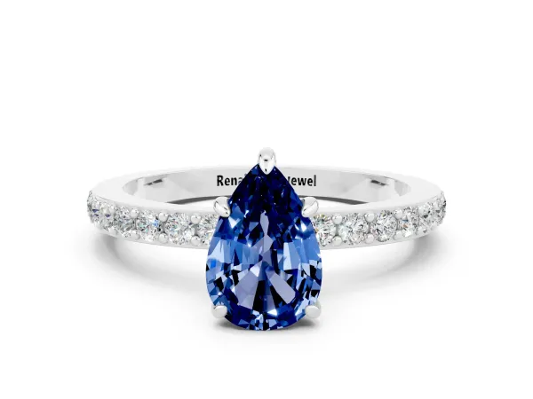 Pear Cut Blue Sapphire Solitaire Engagement Ring with Pavé Band and Four-Prong Setting Platinum