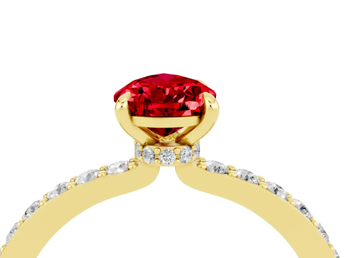Pear Cut Ruby Solitaire Engagement Ring with Pavé Band and Four-Prong Setting Yellow gold