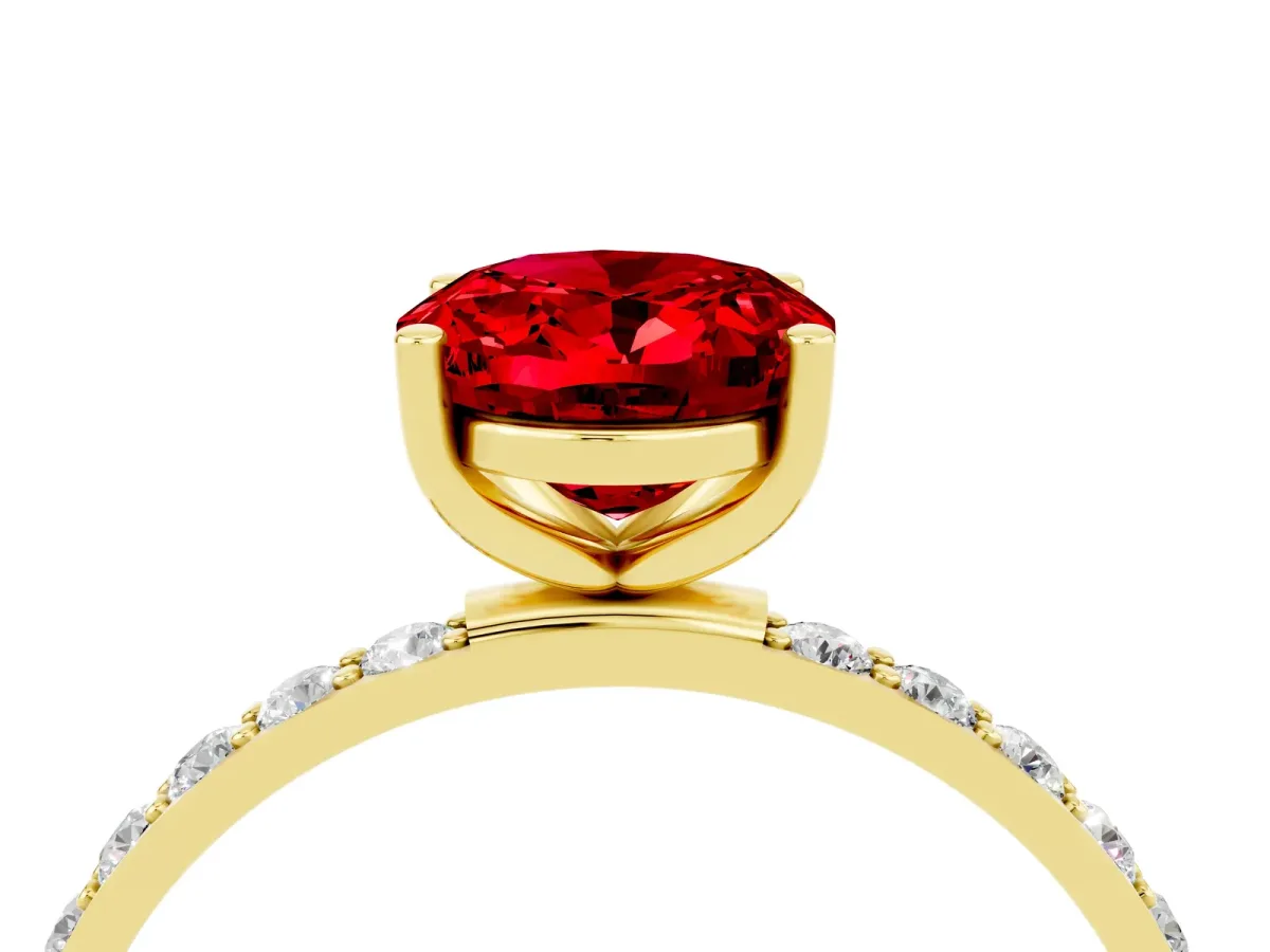 Oval Cut Ruby Solitaire Ring with Round Pavé Band and Prong Setting Yellow gold