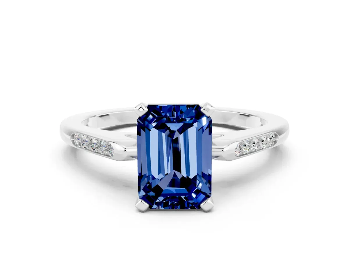 Emerald Cut Blue Sapphire Solitaire Ring with Channel Set Round Band and Prong Setting Silver