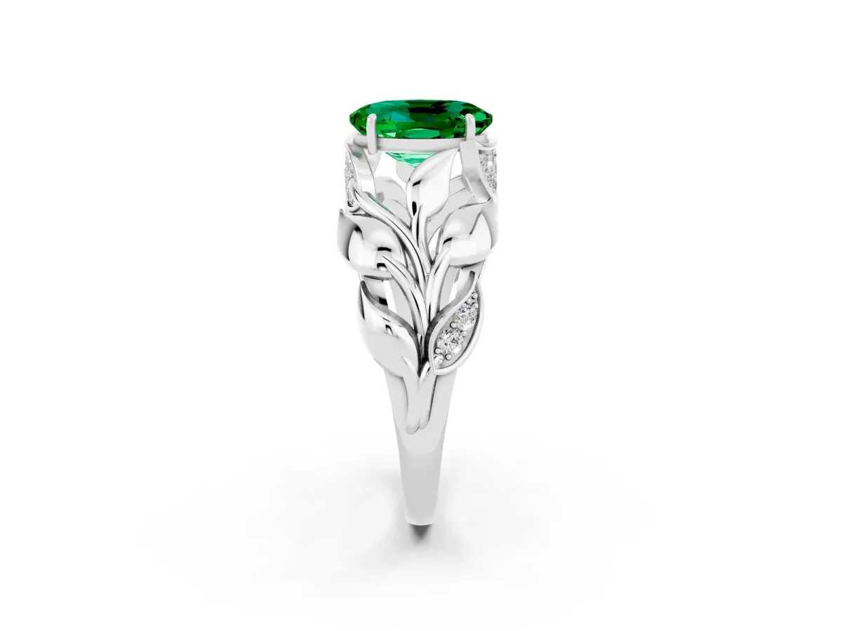 Oval Cut Emerald Leaf-Inspired Engagement Ring with Round Accents and Prong Setting Platinum