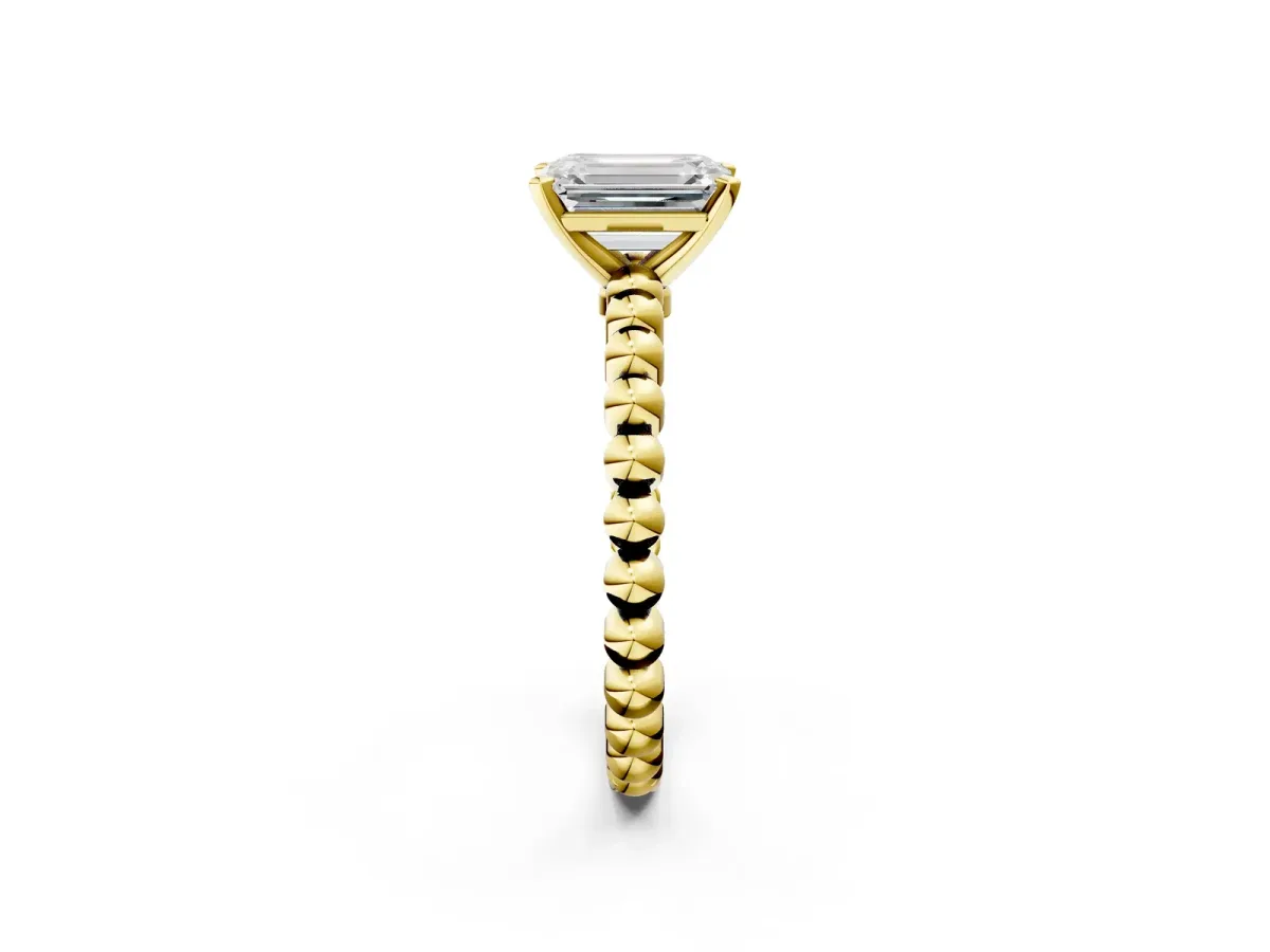 Emerald Cut Diamond Solitaire Ring with Beaded Band and Prong Setting Yellow gold