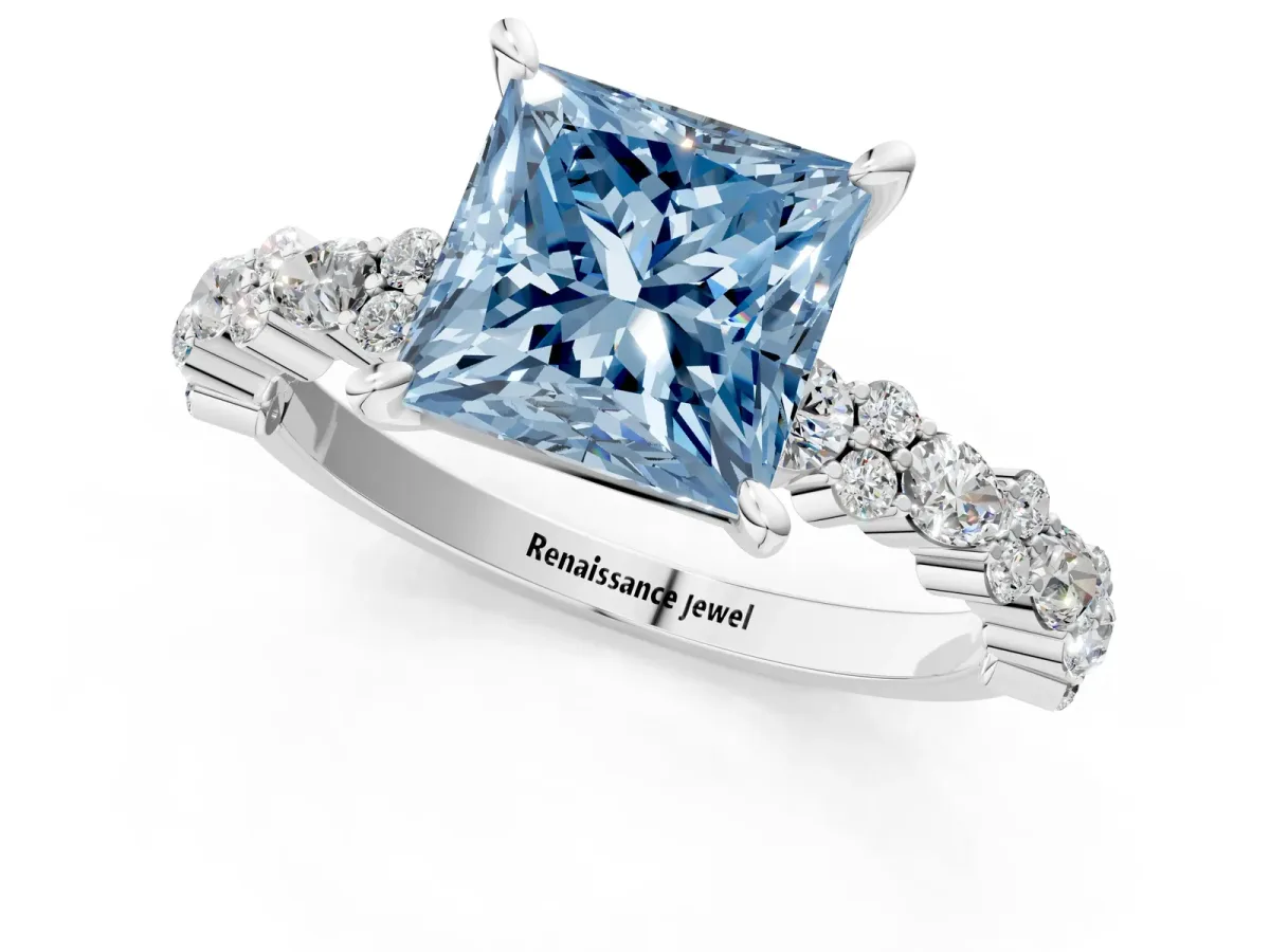 Fancy Blue Princess Cut Diamond Side Stone Solitaire Ring with Round and Four-Prong Setting Silver