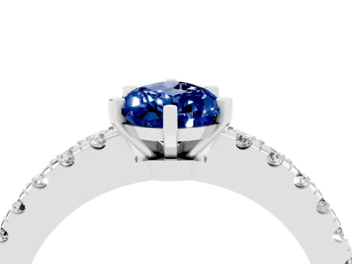Pear Cut Solitaire Blue Sapphire with Pavé Band and Four-Prong Setting Silver