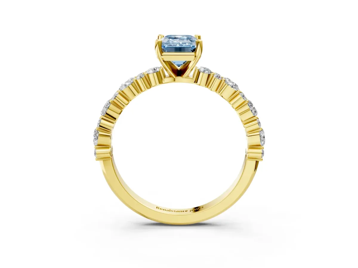 Fancy Blue Emerald Cut Diamond Side Stone Solitaire Ring with Round and Four-Prong Setting Yellow gold
