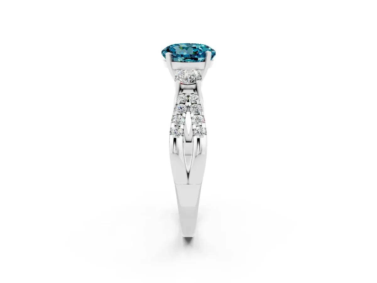 Round Cut Blue Topaz Three-Stone Ring with Pavé Split Shank and Four-Prong Setting Silver