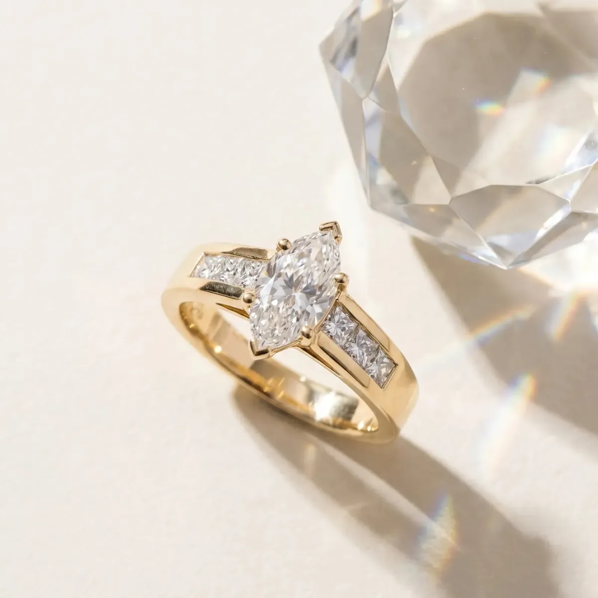 Marquise Cut Cut Channel Set Solitaire Ring with Four-Prong Setting Yellow gold