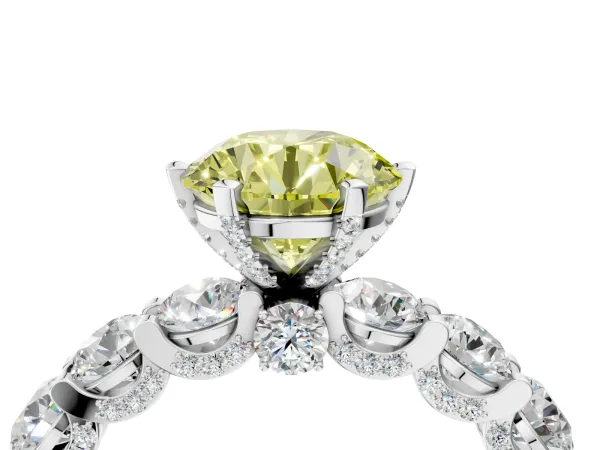 Fancy Yellow Round Cut Diamond Side Stone Engagement Ring with Four-Prong Setting Platinum