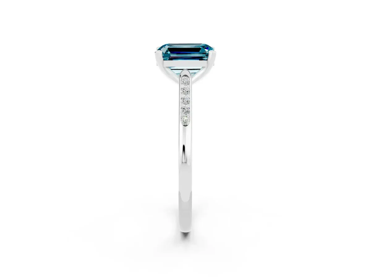 Emerald Cut Blue Topaz Solitaire Ring with Channel Set Round Band and Prong Setting Silver
