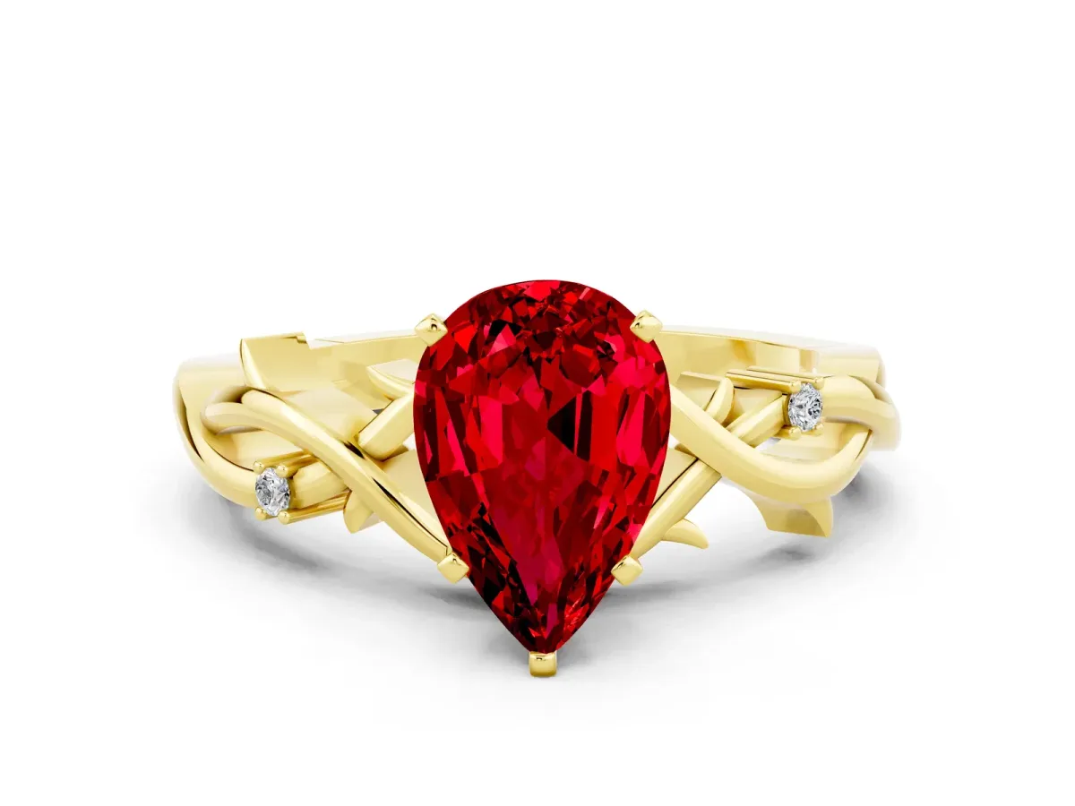 Pear Cut Ruby Solitaire Ring with Twisted Band and Prong Setting Yellow gold