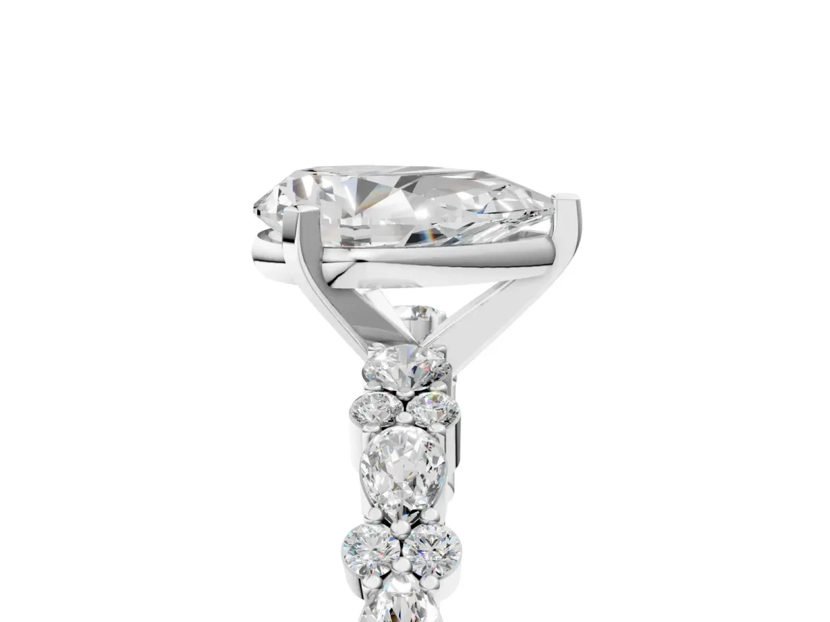 Pear Cut Diamond Side Stone Solitaire Ring with Round and Four-Prong Setting Platinum