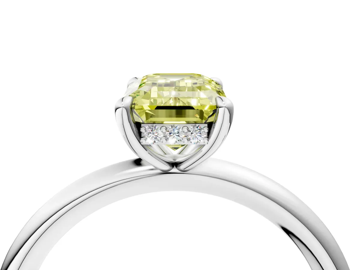 Fancy Yellow Emerald Cut Diamond Solitaire Ring with Thin Band and Four-Prong Setting Platinum