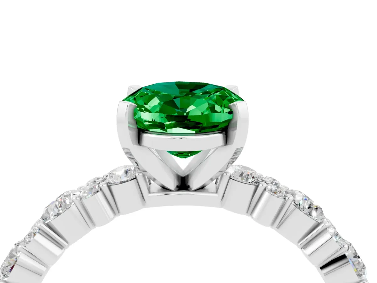 Oval Cut Emerald Side Stone Solitaire Ring with Round and Four-Prong Setting Platinum