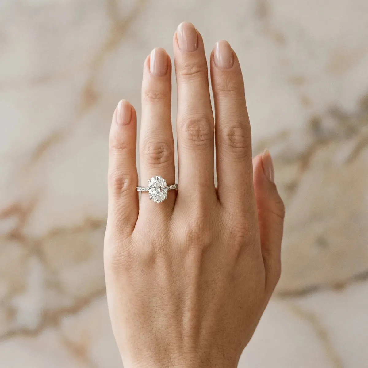 Oval Cut Diamond Solitaire Ring with Round Pavé Band and Prong Setting Silver