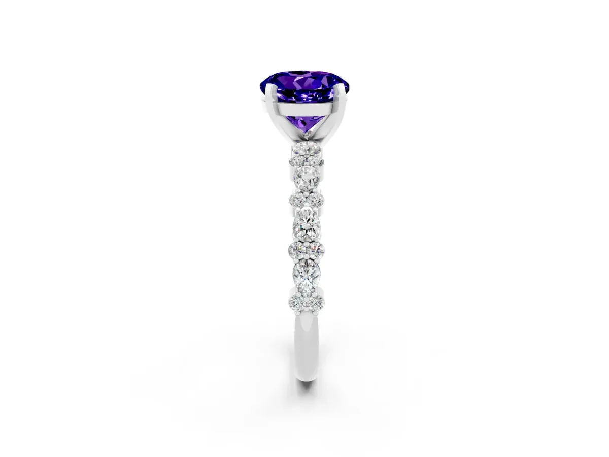 Round Cut Tanzanite Side Stone Solitaire Ring with Round and Four-Prong Setting Silver