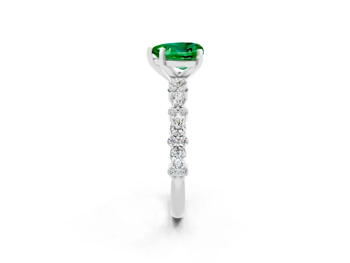 Heart Cut Emerald Side Stone Solitaire Ring with Round and Four-Prong Setting Platinum