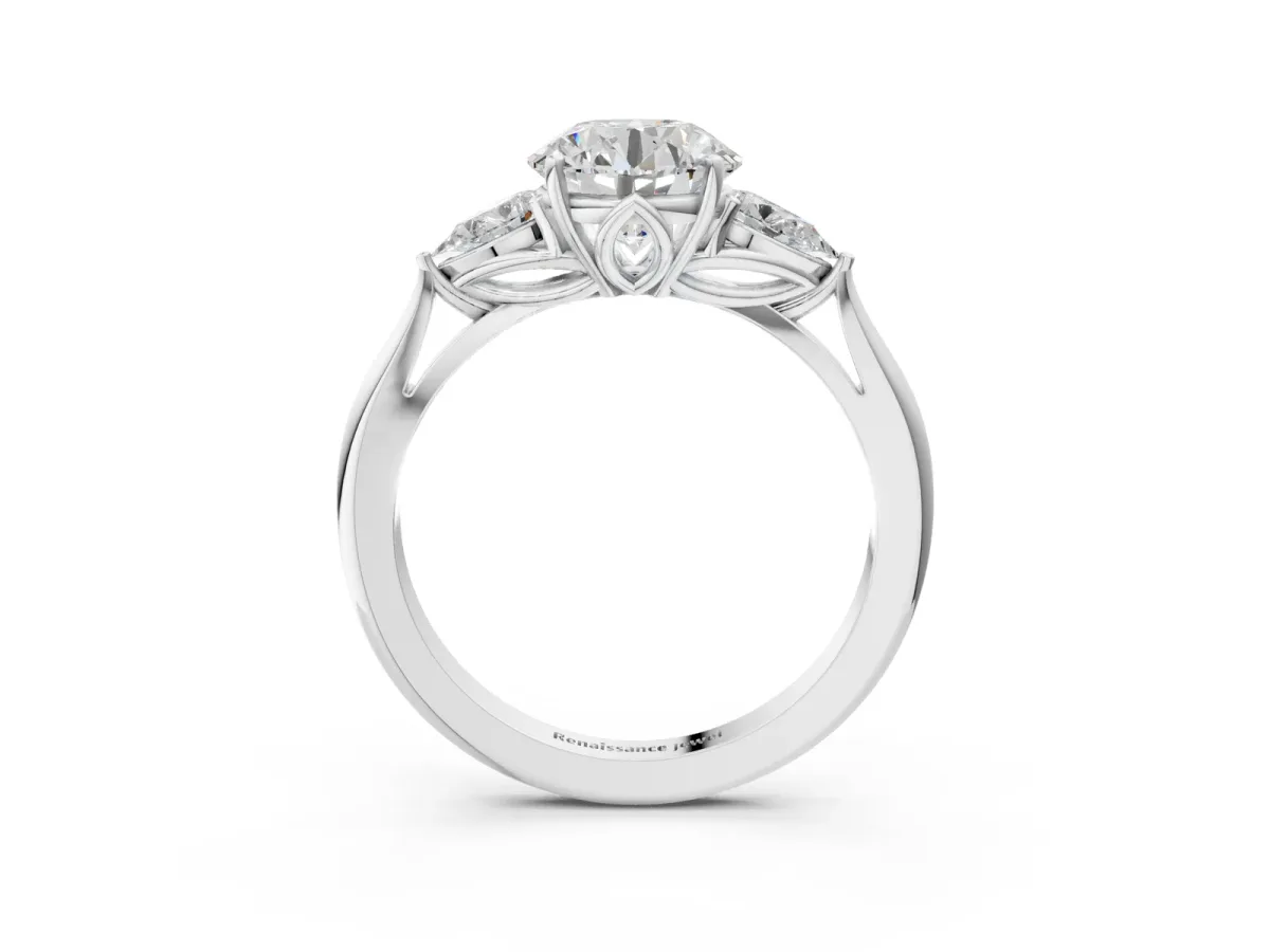 Three-Stone Round Cut Diamond Ring with Pear Side Stones in Four-Prong Setting Platinum