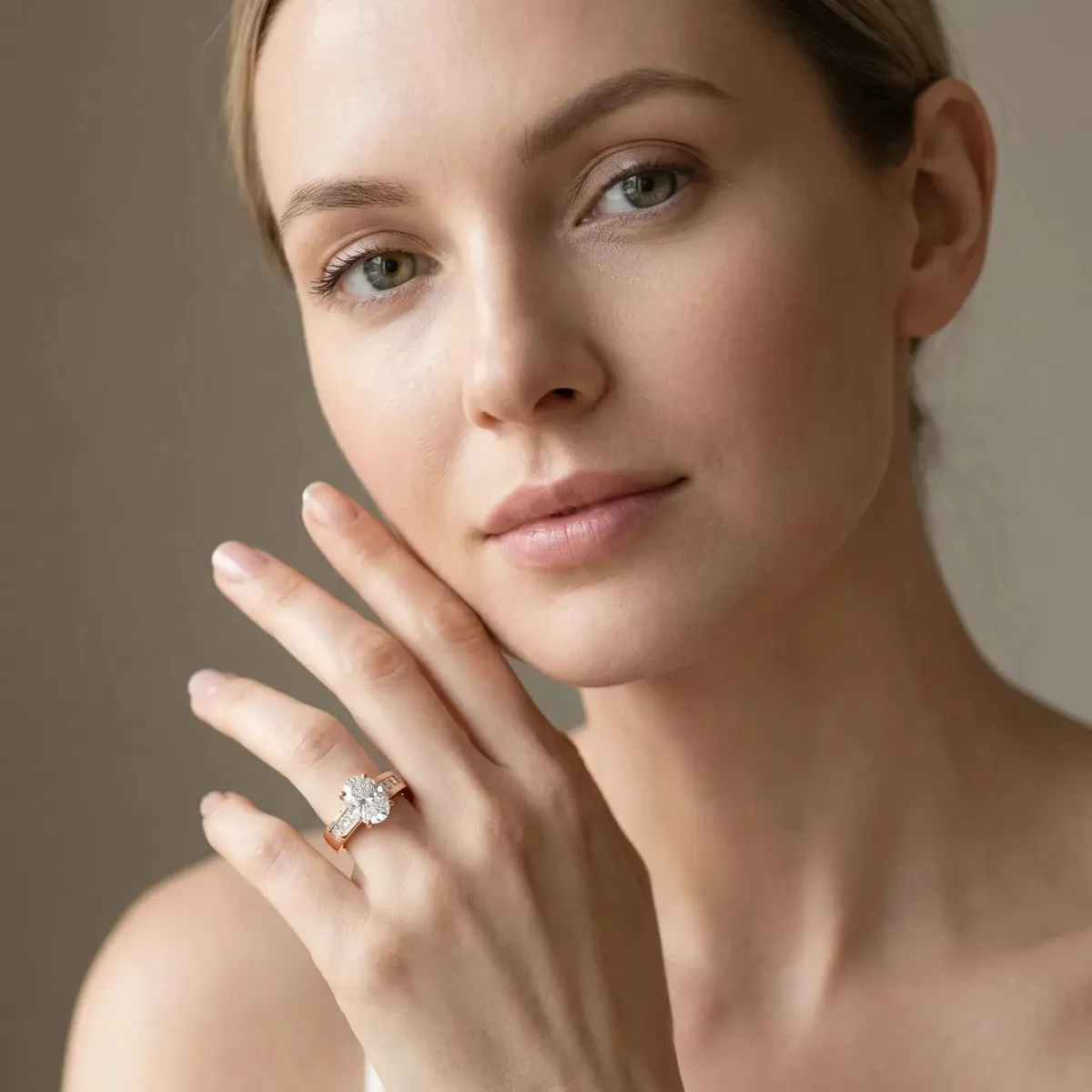 Oval Cut Cut Channel Set Solitaire Ring with Four-Prong Setting Rose gold